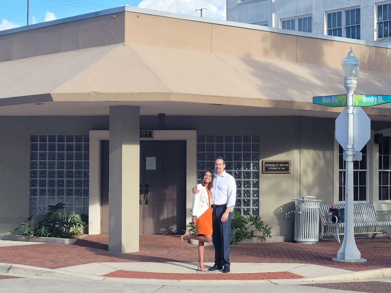 Indera and Tom DeMine standing outside the future site of the Fort Myers office, before renovation